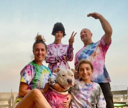 Jamie Roussell and Ian Roussell with their kids, Jayce, Ava Roussell, and pet dog. 